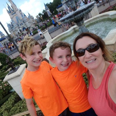 All smiles in front of Cinderella Castle at Magic Kingdom