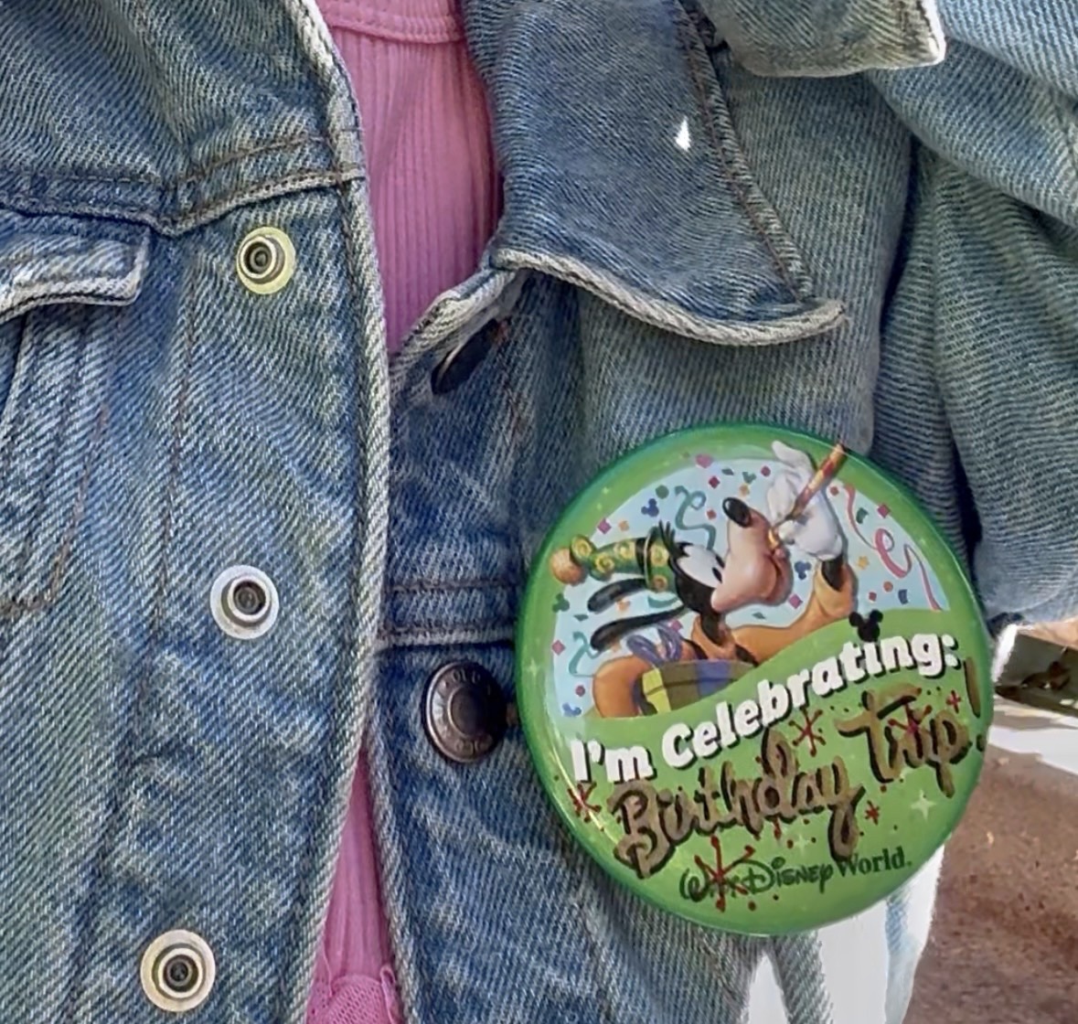 “I’m Celebrating Being Three” button with Cinderella Castle in background at Walt Disney World