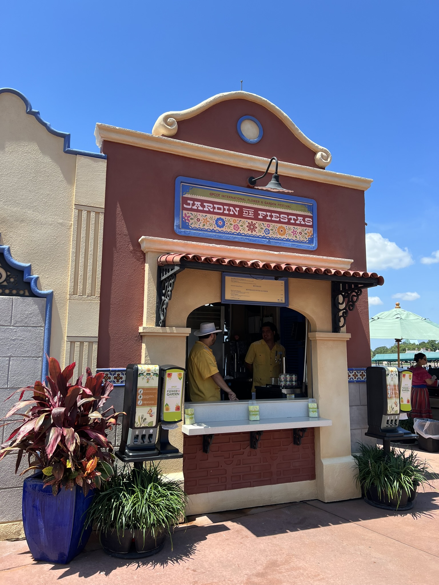 Jardin de Fiestas Outdoor Kitchen booth at the EPCOT International Flower & Garden Festival on a sunny day