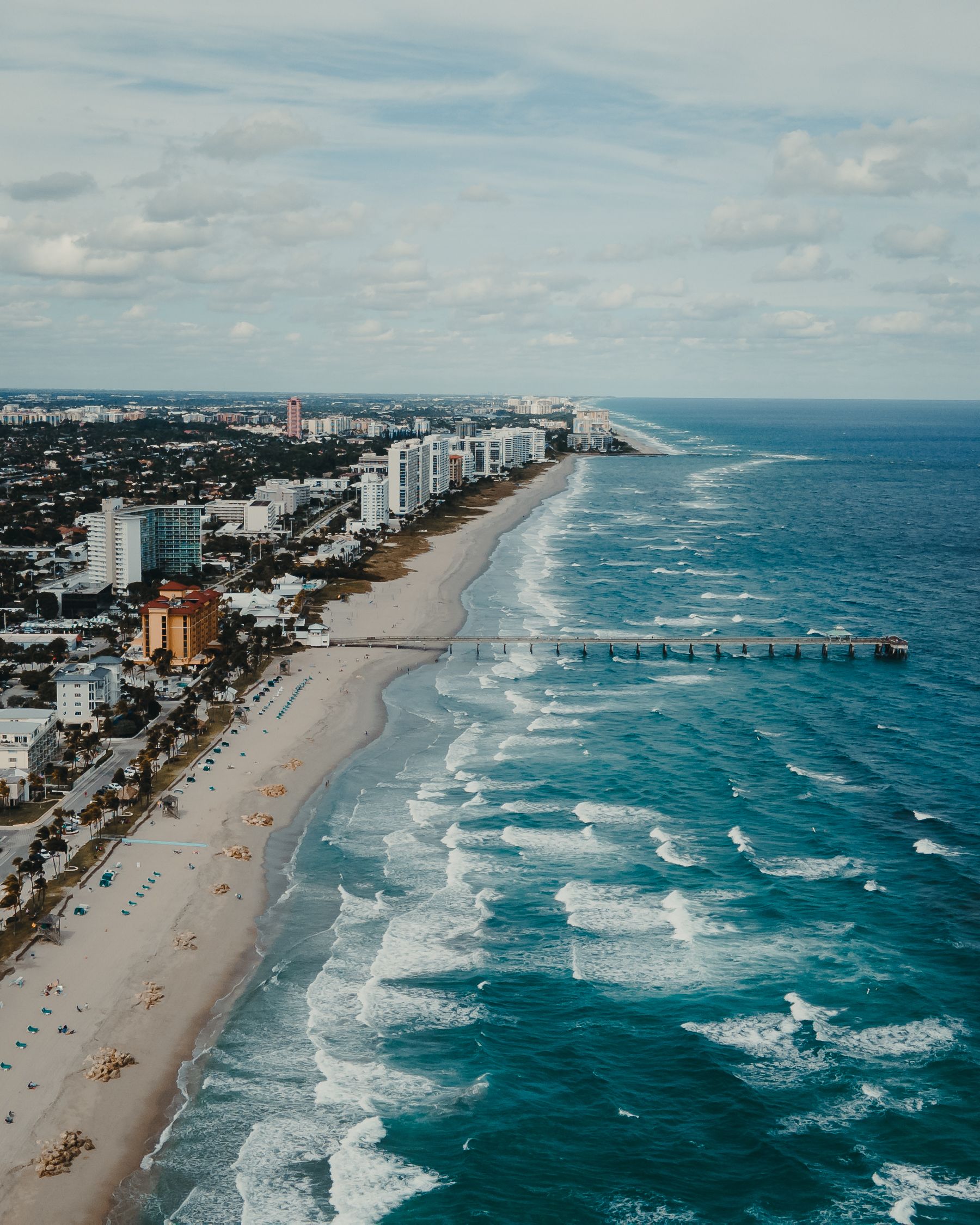 Aerial view of Fort Lauderdale’s Atlantic coastline, beach and waterfront buildings.